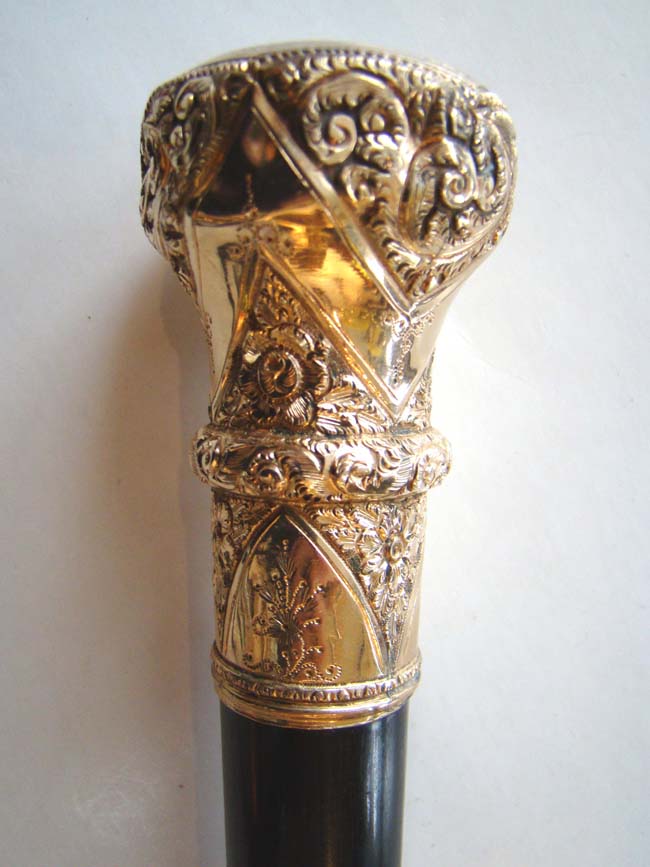 A fine Antique Gold Knobbed cane with ebony shaft and presentation inscription